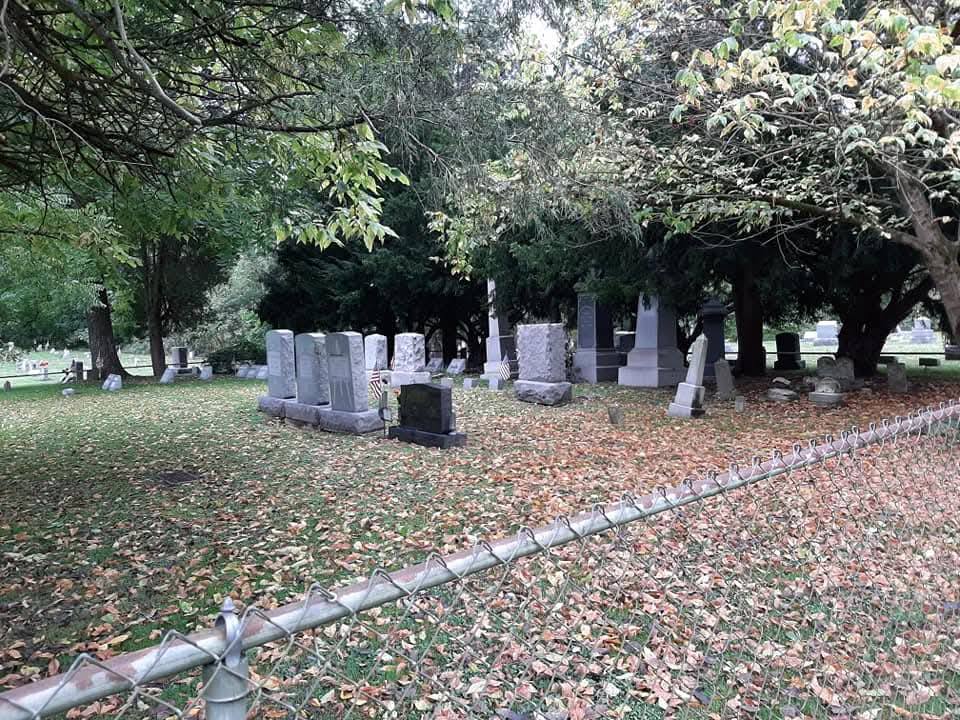 Volunteers at a cemetery work day
